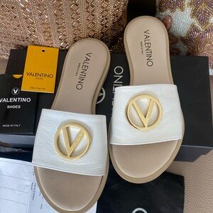 Mario Valentino size 6 white leather slides.